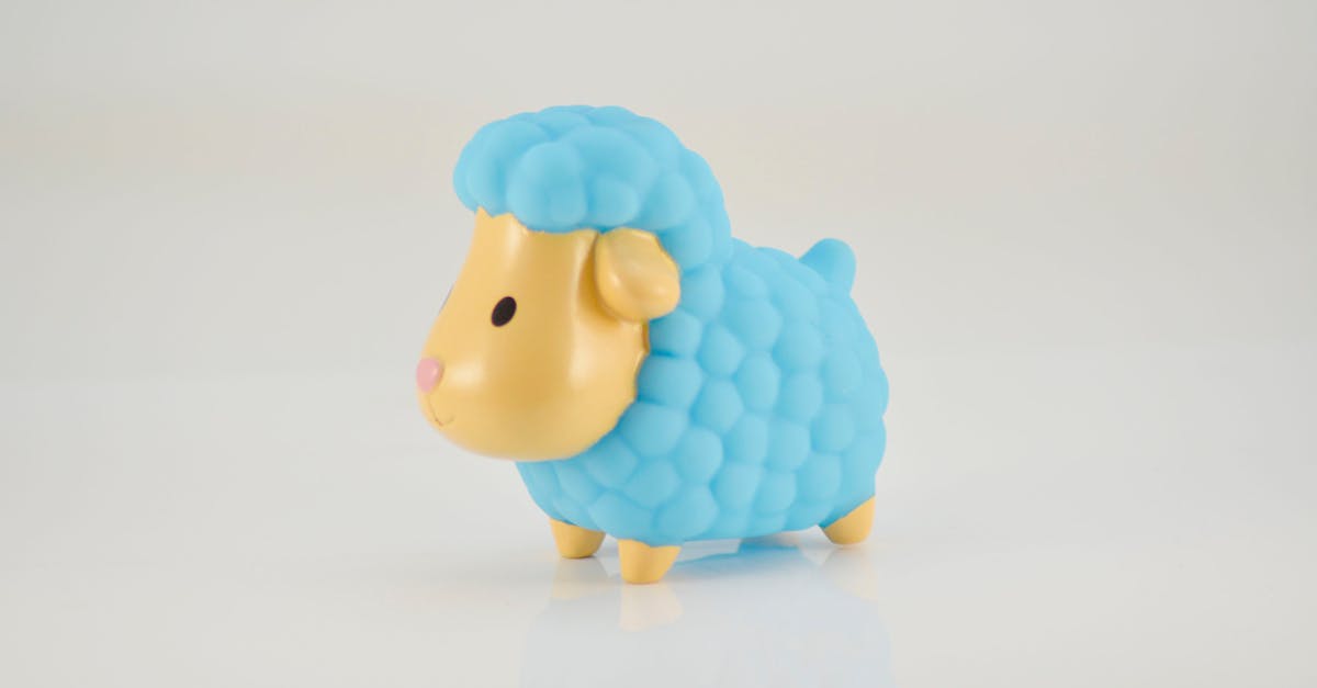 Adorable blue sheep rubber toy perfect for bath time fun. Bright colors and cute features.